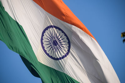 India flag flying high at connaught place with pride in blue sky, india flag fluttering, indian flag