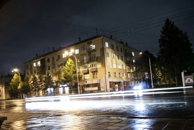 Buildings in city at night