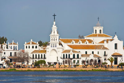 Buildings in city against clear sky