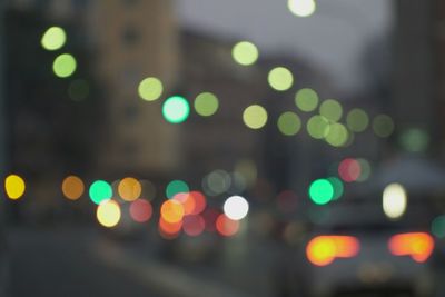 Defocused image of illuminated city at night