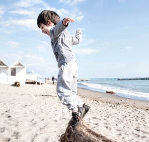 Full length of man on beach against sky