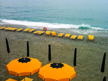 High angle view of yellow umbrella on beach