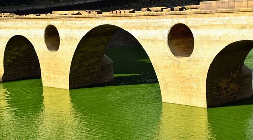 Arch bridge over river