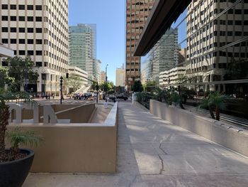 City street amidst buildings against sky