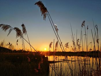 Scenic view of lake against sky during sunset