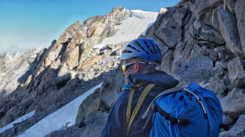 Rear view of person on rockface of mountain