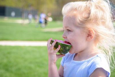 Close-up of girl eating watermelon