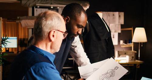 Side view of man working at office