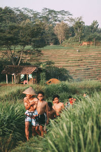 People on field against trees