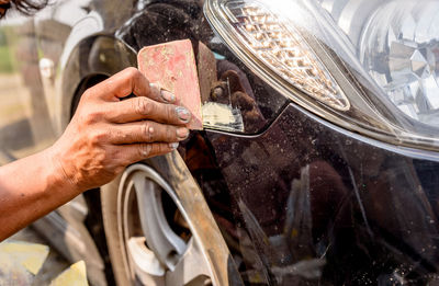 Close-up of man hand on motorcycle