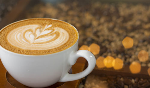 Close-up of cappuccino on table