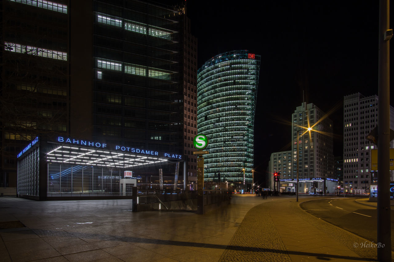 ILLUMINATED SKYSCRAPERS AT NIGHT