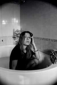 Beautiful young woman in bathroom