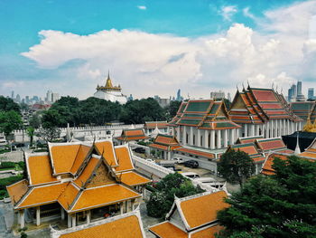 High angle view of buildings in city against sky