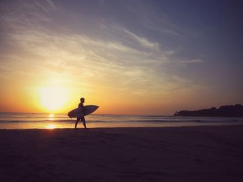 Scenic view of sea at sunset