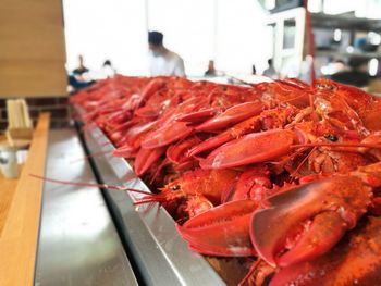 Close-up of red chili peppers on table