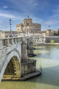 Tevere river and castle sant'angelo in rome with a spectacular sky