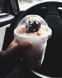 Close-up of hand holding ice cream cone