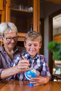 Portrait of happy family sitting at home