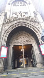 Low angle view of illuminated entrance of cathedral