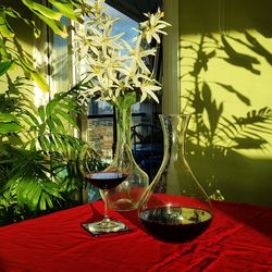 Close-up of wine glasses on table