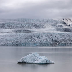 Chunk of iceberg floating in the fjallsarlon glacier lagoon lake in south iceland