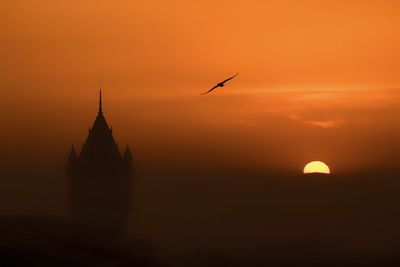 Silhouette of church at sunset