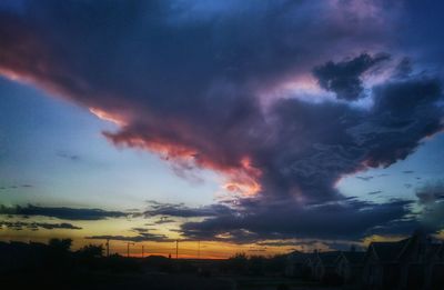 Scenic view of landscape against cloudy sky