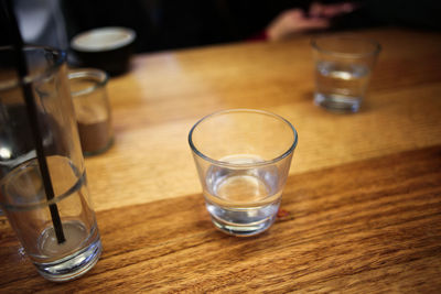 Close-up of drinking glasses on table