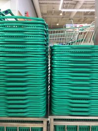 Stack of shopping baskets at supermarket