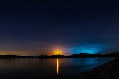 Scenic view of sea against sky at night