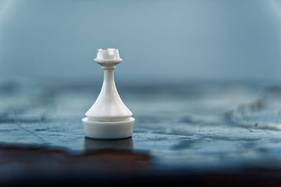 Close-up of chess pieces on table