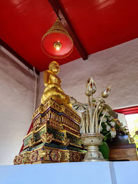 Low angle view of statue against temple building