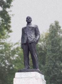 Low angle view of statue against sky