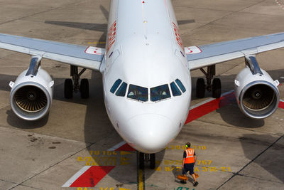 High angle view of airplane on airport runway