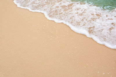 High angle view of surf on beach