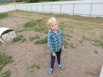 High angle portrait of girl standing on land