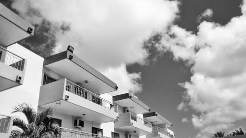 Low angle view of building against cloudy sky