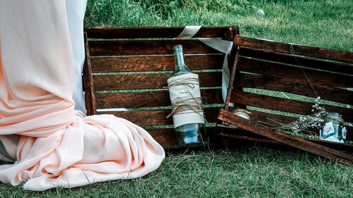 Low section of woman relaxing on field