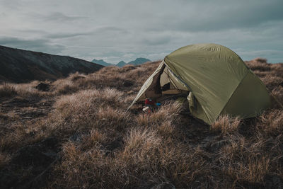 Tent on mountain against sky