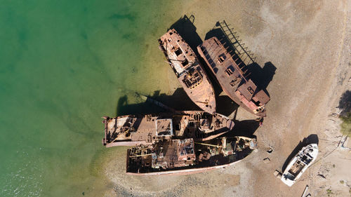 High angle view of old abandoned building by sea