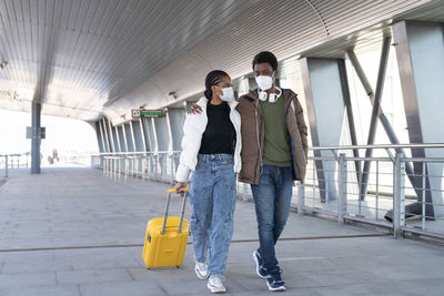 Full length of young couple walking outdoors