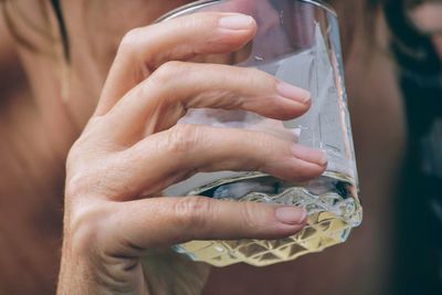 Close-up of hand holding water