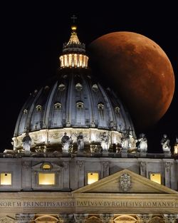 View of illuminated building against sky at night