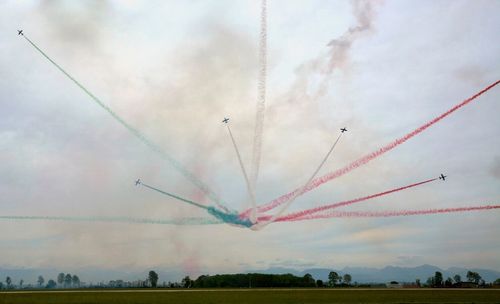 Low angle view of airplane flying against sky