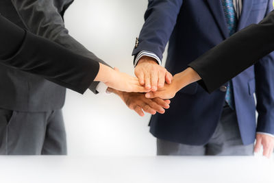 Low angle view of people holding hands