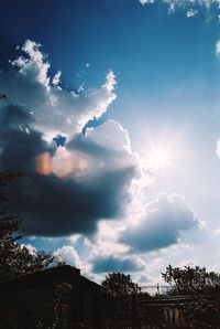 Low angle view of silhouette trees against sky