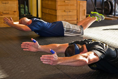 Side view of woman exercising in gym