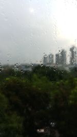 Full frame shot of wet glass window in rainy season