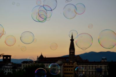 Close-up of bubbles against sky